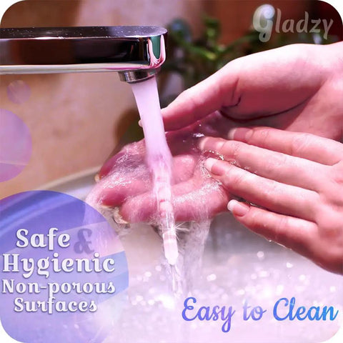 Glass Cuticle Pusher Manicure Stick With Slanted Side And Pointed End Being Washed Under Running Water