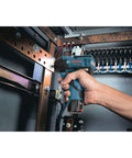 Using 12V Max Brushless Three Eighths Inch Impact Wrench Bare Tool Ultra Compact Five Point Five Inch Head Lightweight One Point Six Pound Tool for electrical work inside a panel box.
