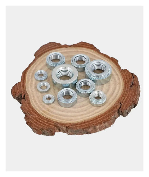 Rock Solid Carbon Steel Clinch Nuts With Knurled Grip For Secure Riveting On Thin Sheet Metal, assorted sizes on wood