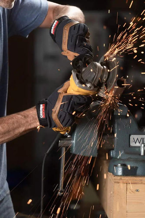 Person using an angle grinder with Gel Pro Leather Hybrid Mechanic Gloves with Gel Impact Protection and Touchscreen Capability.
