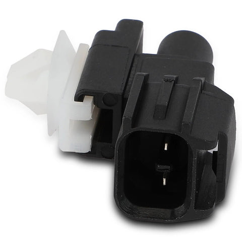 Close-up of black air temperature sensor connector with white locking clip and two metal pins.