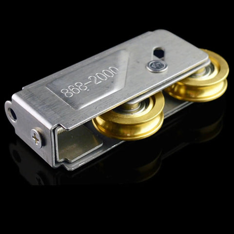 Top Shelf Stainless Steel And Copper Double Wheel Pulley Rollers For Sliding Doors And Windows Bulletproof Heavy Duty Silent Cabinet Track Wheels With No Sweat Install 2 Pack close-up view of dual copper wheels and stainless steel housing.