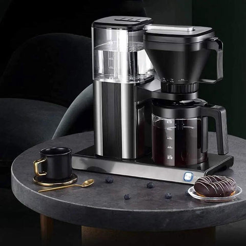 Heavy Duty Fully Automatic Espresso And Drip Coffee Maker With Digital Display Six Steam Nozzles For Killer Brews on black table with cup.
