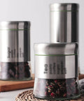 600 Milliliter Airtight Glass Coffee Storage Jar With Stainless Steel Lid Locks In Aroma For Beans Grounds Tea And Nuts on kitchen counter.