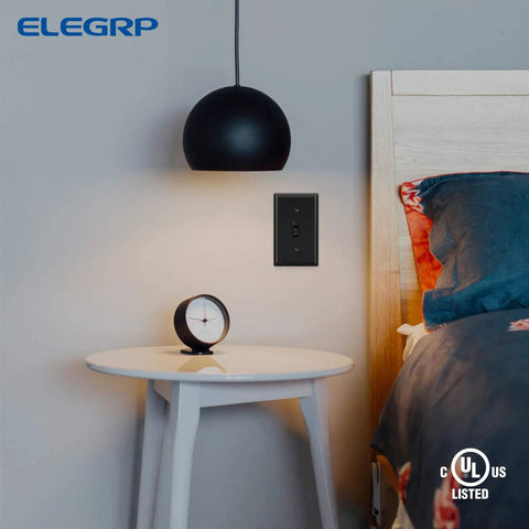 Bedroom with No-Fuss Quiet Self-Grounding Single Pole Toggle Light Switch 15 Amp 120 Volt in black, UL listed.