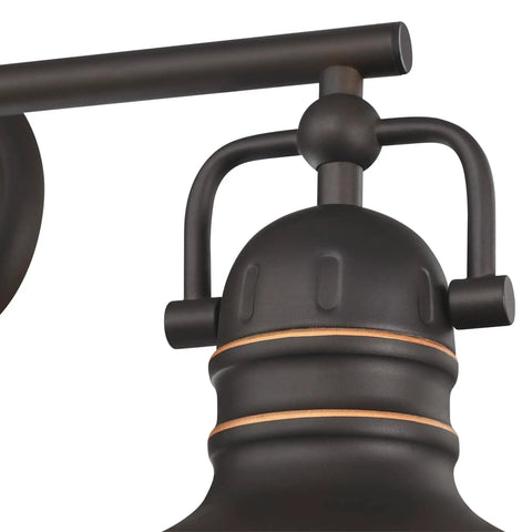 Close-up of Vintage Style Three-Light Indoor Vanity Light Fixture in Oil Rubbed Bronze with highlights and frosted lens detail.