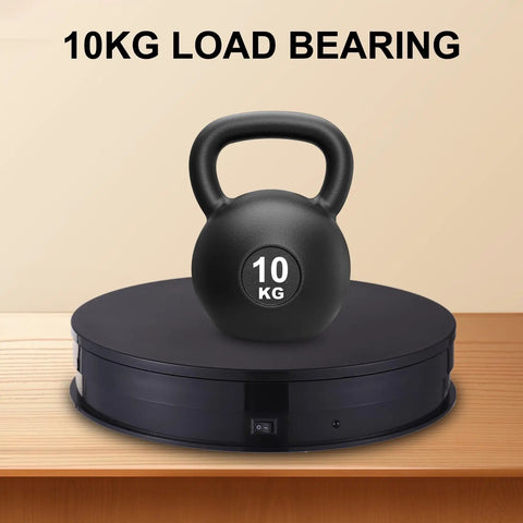 Smooth Mingzhe Motorized Rotate Display Stand With Led Lighting And Remote For Photo Shoots Shows That Handle Up To 10kg With Ultra Quiet Performance showcasing a 10kg kettlebell.