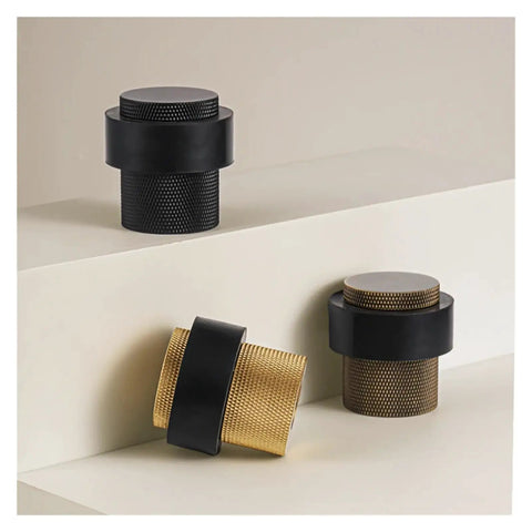 Stylish Knurled Brass Floor Mount Door Stopper With Non Magnetic Bumper Catch Holder To Block Doors And Protect Walls In Your Home, showing black and brass finishes.