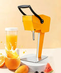 Heavy Duty Electric Citrus Juicer With Three-Blade Steel Cutter Head For High Yield And Quick Press Operation Detachable Design placed beside fresh fruit and juice.