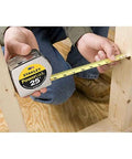 Person using PowerLock Tape Measure Set Of Four 30 Foot Each Mylar Coated Durable Blade For Long Life On Job Sites Secure