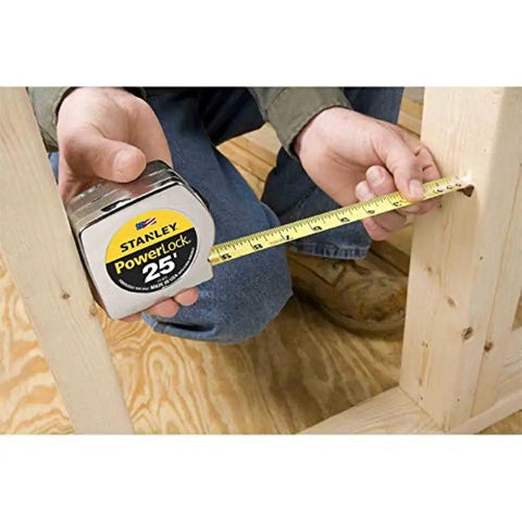 Person using PowerLock Tape Measure Set Of Four 30 Foot Each Mylar Coated Durable Blade For Long Life On Job Sites Secure