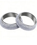 Two 2.5-inch exhaust donut gaskets (65mm) with graphite outer surface and metal inner ring.