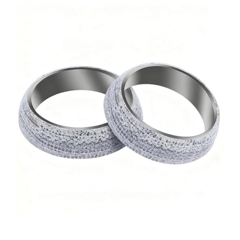 Two 2.5-inch exhaust donut gaskets (65mm) with graphite outer surface and metal inner ring.