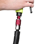 Hand holding Industrial Type D Red 14 Piece Coupler And Plug Kit With 1 Quarter Inch NPT Fittings For Heavy Duty Use.
