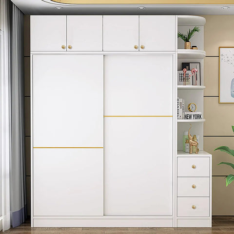 Large white cabinet with brushed gold knobs and handles, featuring sliding doors and open shelving on one side, in modern room.
