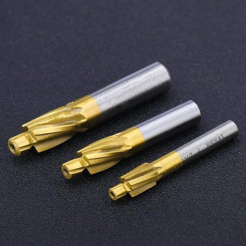 Three WZFC HSS counterbore end mills with gold flutes and silver shanks (M4.2x7.4x6x50)