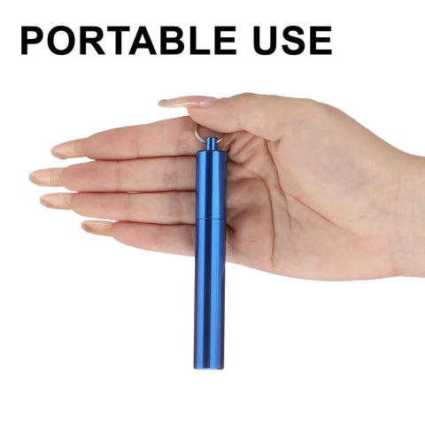 Hand holding a Portable Metal Toothpick Holder Case With Keychain Waterproof Aluminum Alloy Grab And Go Travel Box, blue color.