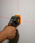 Electronic Stud Finder Pro Grade Ultra Handy With Cross Line Lasers, Bubble Level And LED And Audio Alerts For Wood And Metal Studs, Class 3R Laser 15 Feet In All Directions, Batteries Included on wall