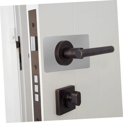 Stainless Steel Door Reinforcement Plate Set 6 Pieces No Drilling Deadbolt Cover And Repair Panel For Apartment Doors Keepin It Secure Rustproof Easy Install Durable installed on a white door with a black handle.