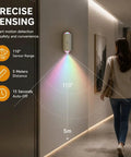 Motion Sensor Night Light With USB C Rechargeable RGB Wall Light For Hallways And Stairs Auto On In Darkness woman walking below light