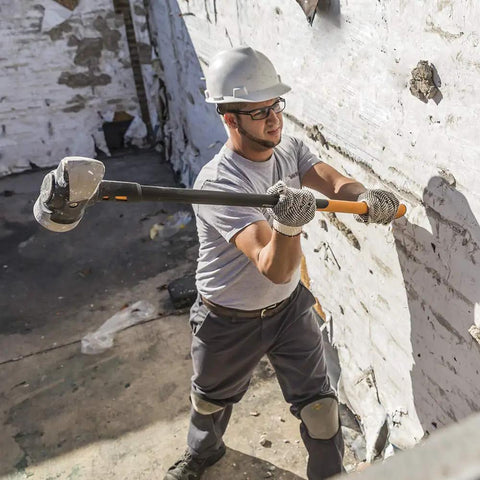 Worker using IsoCore 16 Lb Sledge Hammer For Demolition And Driving With Shock Reduction 24 Inch Pro Grade Beast Heavy Duty Tool
