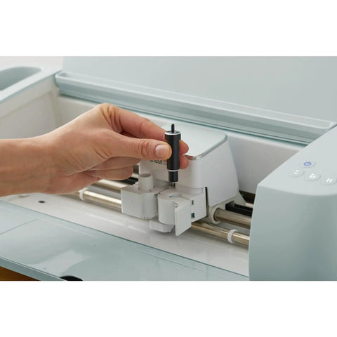 Hand inserting Deep Point Blade and Housing for Craft Cutting Machines With Deep Cut Capability into Cricut machine.