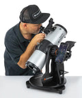 Man using StarSense Explorer 114AZ App Enabled Telescope for Beginners with Smartphone Dock and Sky Tour, 114mm Tabletop Dobsonian.