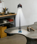 360 Flexible Gooseneck Machine Tool Light 9W Led 6000K white brightness illuminating a workbench, featuring a strong magnetic base.