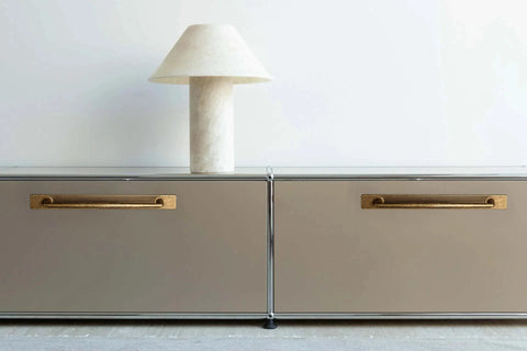Antique Brass Zinc Alloy Cabinet Handle With Backplate 5 Inch Hole Center installed on modern cabinets with decorative lamp.