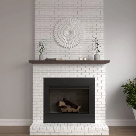 Eryn Ceiling Medallion 24 3/4 Inch Outside Diameter 3 1/4 Inch Inside Diameter 1 7/8 Inch Projection installed on white brick wall above fireplace