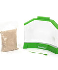 Ant Factory Classroom Ant Farm With Live Ants For Hands On STEM Learning At Home Kids Science Kit Escape Proof Habitat With Large Viewing Area Magnification Spots And Feeding Tool, empty clear plastic habitat with green edges and a bag of sand
