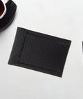 Black Padded Bubble Mailer Envelopes 12x18 and 4 Inch Thick Self Seal Plastic Shipping Bags on desk with pen