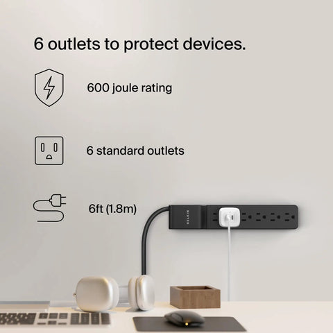 Six Outlet Surge Protector Power Strip With Six Foot Long Heavy Duty Extension Cord 360 Degree Rotating Plug And 600 Joules Of Protection displayed on desk setup.