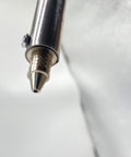 Close-up of nozzle on Automatic Desoldering Pump Vacuum Solder Sucker Tool For DIY AC110V 30W Electric Desoldering Gun.