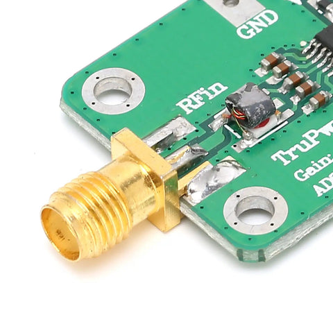 Close-up of RF Detector Module AD8362 50Hz-3.8GHz on green PCB with screw connector, showing detailed circuit components.
