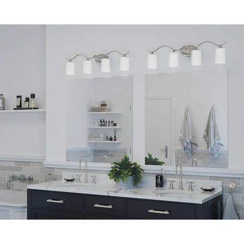 Inspire Collection Four-Light Bath Vanity Light with Etched Glass Shades in Brushed Nickel Finish over a modern bathroom sink.