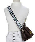 Slap This Wide Adjustable Jacquard Purse Strap On Any Bag For Major Crossbody Vibes And Watch It Slay With Premium Gold Hardware In Chic Triangular Green on a model with a brown bag.