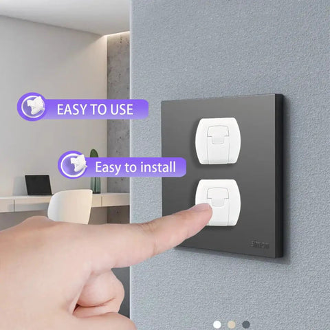 Person pointing to Kid Safe Outlet Covers 32 Pack With Hidden Pull Handle on black wall, showing easy installation