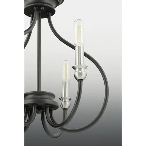 Whisp Collection 4 Light Farmhouse Chandelier In Graphite Black Finish With Candled Scroll Frame, close-up on bulbs and frame
