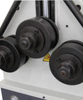 Close-up of Tough Three Roll Hydraulic Metal Bender That Knocks Out Flat Stock And Square Tubes Without A Sweat features pulleys and gauge.