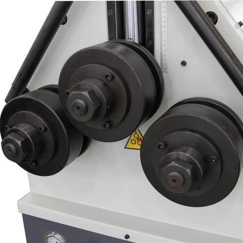 Close-up of Tough Three Roll Hydraulic Metal Bender That Knocks Out Flat Stock And Square Tubes Without A Sweat features pulleys and gauge.
