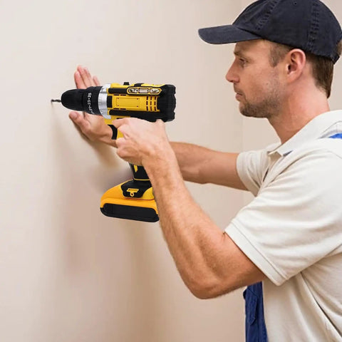 Tough As Nails 21v Cordless Drill Tool Kit used by a worker to screw into a wall, features ergonomic grip, and precision bits.