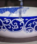 Slick Oval Vessel Sink For Bathroom Vanity Top Notch Premium Porcelain Countertop Wash Basin featuring hand painted blue floral motif.