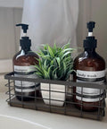 Farmhouse Small Metal Wire Storage Basket With Wooden Bottom Black Rustic Organizer holding shampoo and body wash bottles
