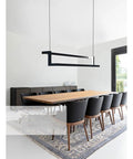 Modern LED Pendant Light Rock Solid Aluminum Body With Effortless Remote Dimming And Soft Warm White Glow in dining setup.
