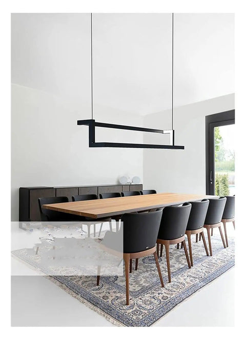 Modern LED Pendant Light for Dining Living Room Lustre Suspension Interior LED Pendant Lamp for Office Kitchen (Colour: Warm White Size: L80x12cm40W) (Dimmingwithremote L80x12cm40W) hanging over a wooden dining table with black chairs.