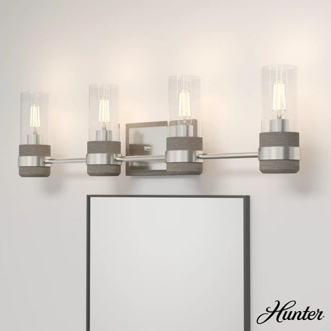 Four Light Vanity Light In Brushed Nickel Sleek Rustic Style Dimmable Fixture With Clear Seeded Glass Shades For Bedrooms Kitchens Foyers And Bathrooms Medium Size Durable Steel Construction above mirror