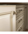 Aspen Round Cabinet Knob In Light Bronze Finish, One And One Eighth Inch Diameter, Seven Eighths Inch Projection on drawer