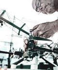 Person using Zyklop Quarter Inch Drive Socket With Holding Function For Screws on a drone propeller assembly.