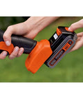 Inserting 20V battery into Lightweight Cordless Hedge Shear Kit With Three Eighth Inch Cut, Interchangeable Four And Eight Inch Blades